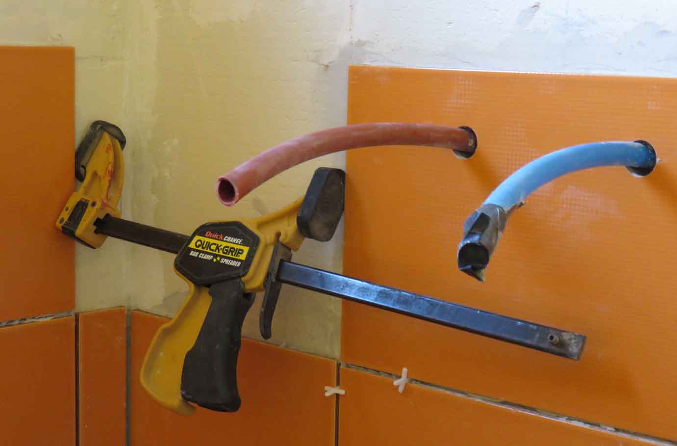 clamp holding tile in place
